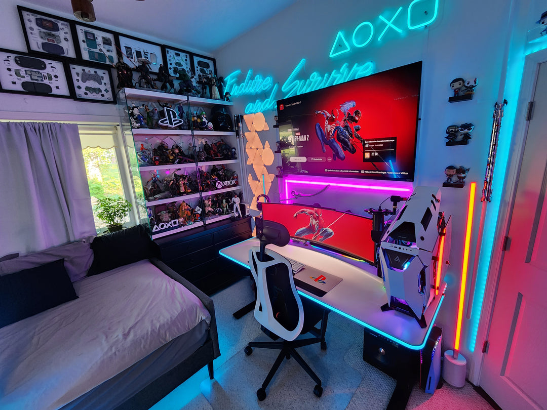 a bedroom with a bed, desk, and computer