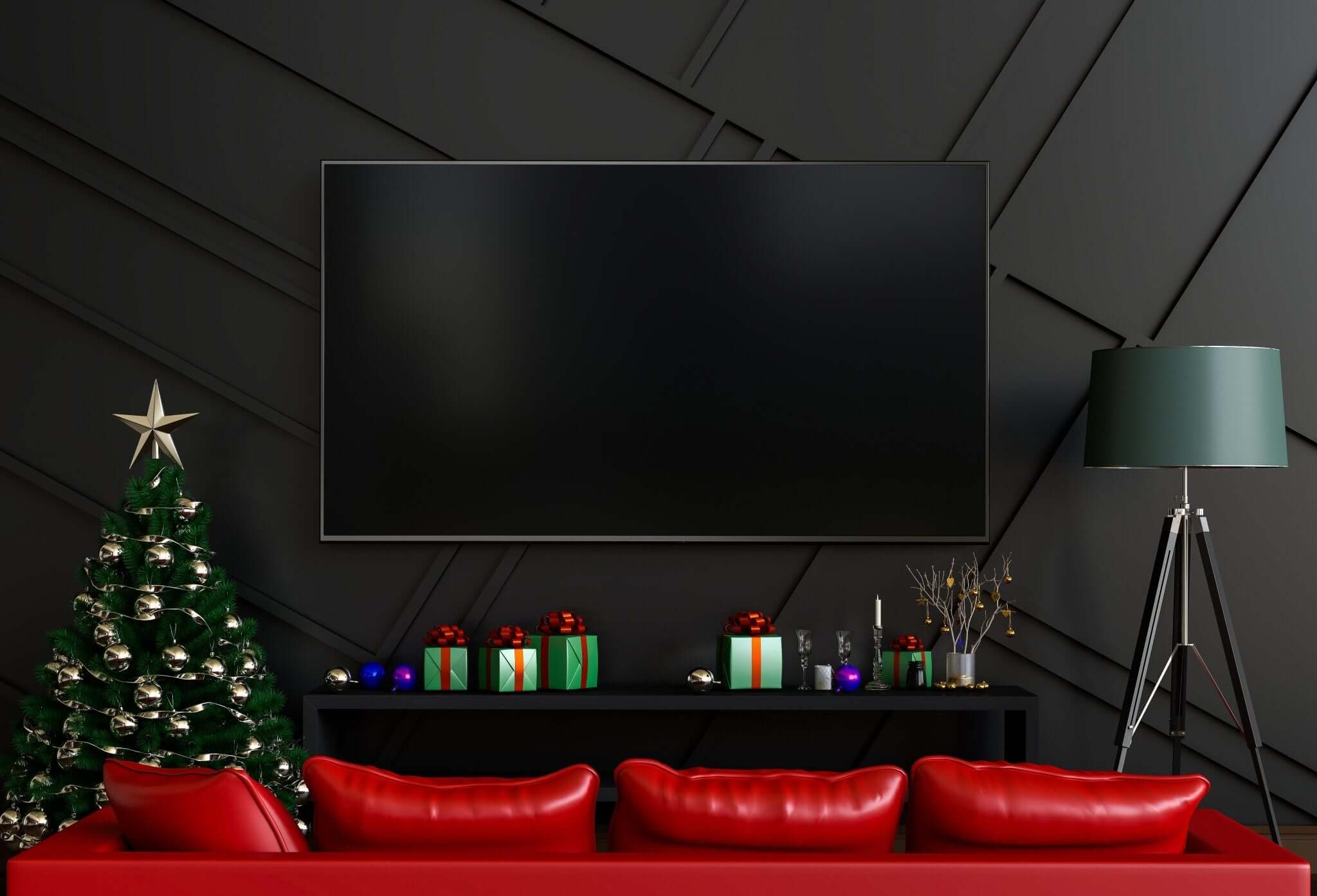 a living room with a red couch and a christmas tree