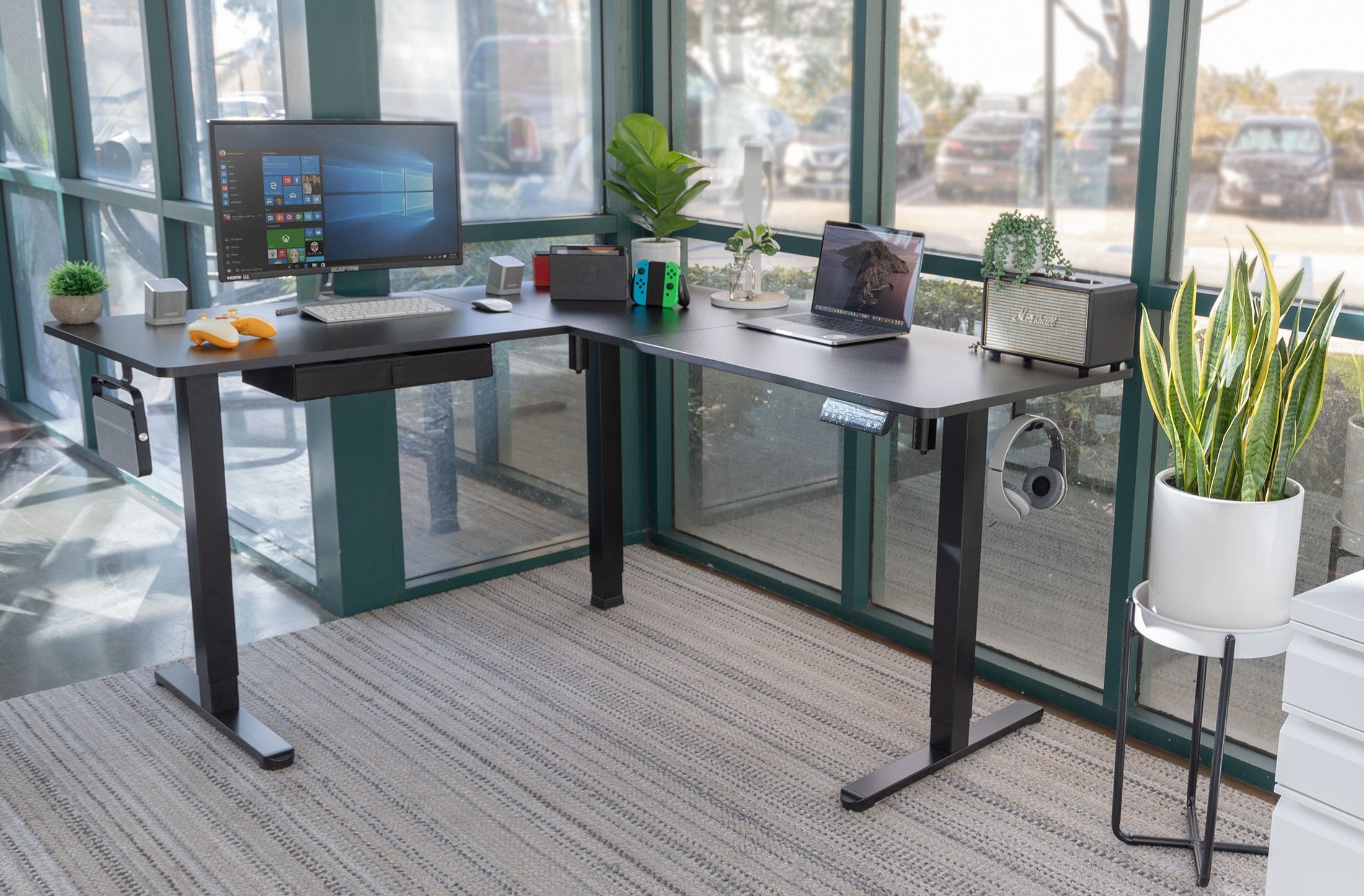 a corner standing desk with a computer on top of it