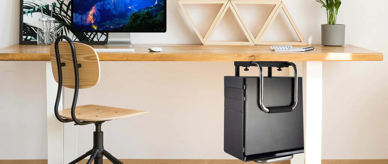 a computer monitor sitting on top of a wooden desk