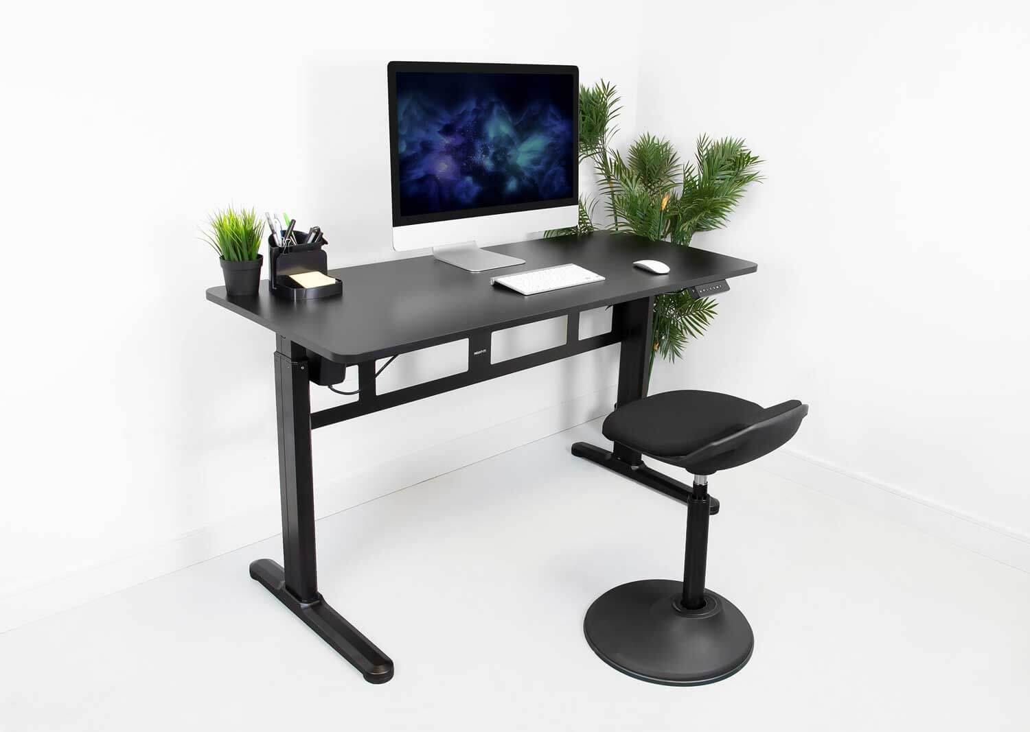 a computer desk with a computer on top of it