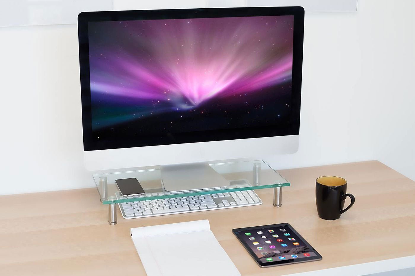 a desktop computer sitting on top of a wooden desk