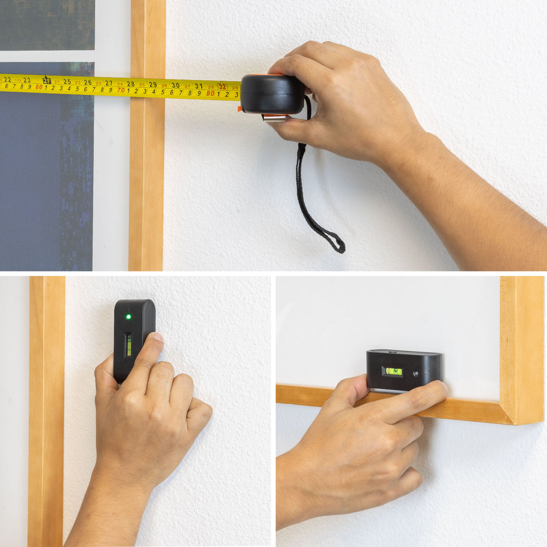 a person measuring a wall with a tape measure